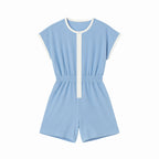 Light blue romper with white trim on a white background
